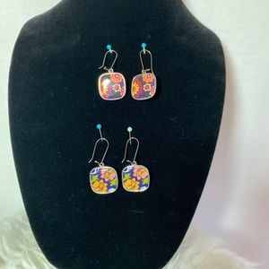 Two pairs of reversible floral earrings.